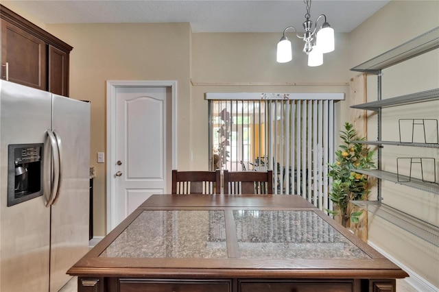 dining area featuring a chandelier
