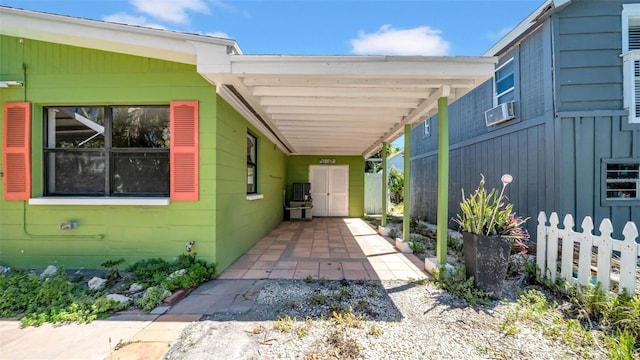 121 86th Ter, Treasure Island, FL 33706 - view of patio / terrace with a carport