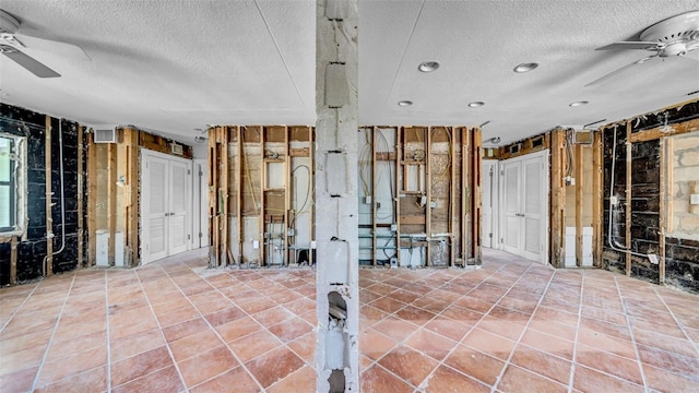 121 86th Ter, Treasure Island, FL 33706 - misc room featuring a ceiling fan, a textured ceiling, recessed lighting, and wooden walls