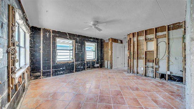 121 86th Ter, Treasure Island, FL 33706 - spare room featuring a ceiling fan and a textured ceiling