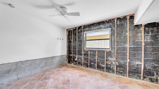 121 86th Ter, Treasure Island, FL 33706 - spare room featuring a ceiling fan, a smoke detector, and a textured ceiling