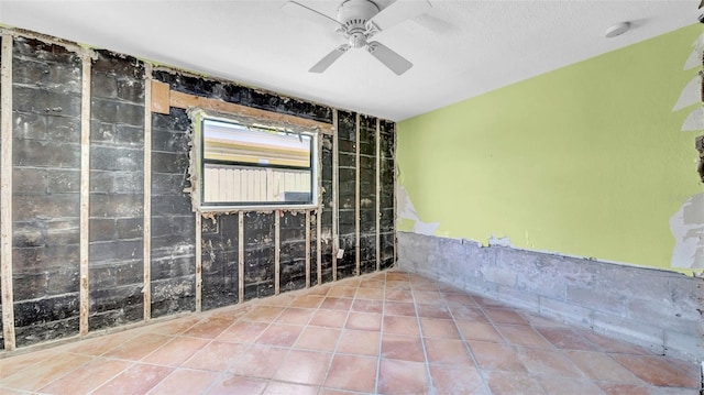121 86th Ter, Treasure Island, FL 33706 - tiled empty room with ceiling fan and a smoke detector