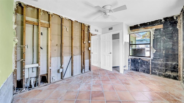 121 86th Ter, Treasure Island, FL 33706 - bathroom featuring ceiling fan and tile patterned flooring