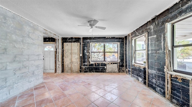 121 86th Ter, Treasure Island, FL 33706 - unfurnished room featuring ceiling fan and a textured ceiling