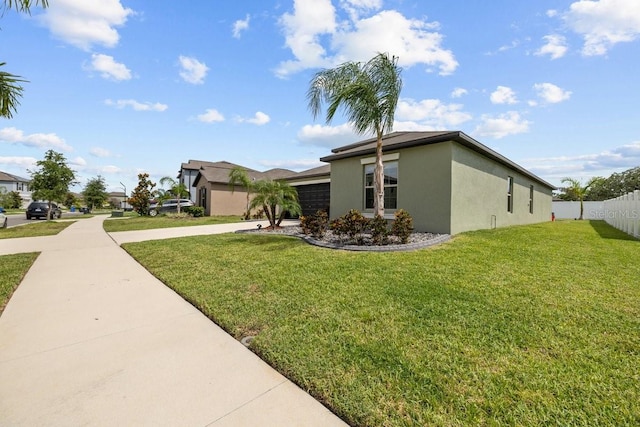 10333 Scarlet Skimmer Dr, Riverview, FL 33578 - view of side of property with stucco siding, driveway, and a garage