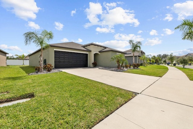 10333 Scarlet Skimmer Dr, Riverview, FL 33578 - view of front of house with concrete driveway, an attached garage, and stucco siding
