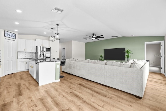 10333 Scarlet Skimmer Dr, Riverview, FL 33578 - living room with lofted ceiling, recessed lighting, light wood finished floors, and a ceiling fan