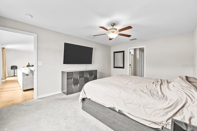 10333 Scarlet Skimmer Dr, Riverview, FL 33578 - carpeted bedroom with baseboards and ceiling fan