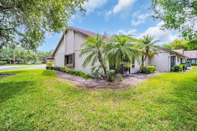 2506 Laurelwood Dr Unit 4C, Clearwater, FL 33763 - view of home's exterior with a lawn and stucco siding