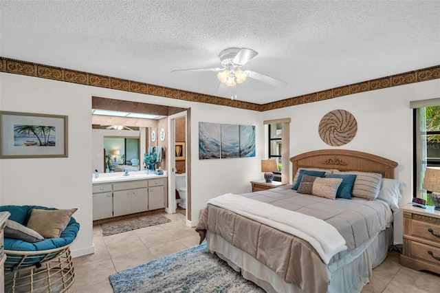 2506 Laurelwood Dr Unit 4C, Clearwater, FL 33763 - bedroom with light tile patterned flooring, a textured ceiling, and a sink