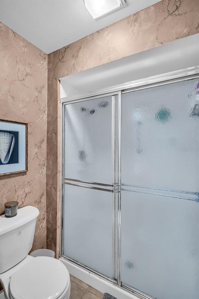 2506 Laurelwood Dr Unit 4C, Clearwater, FL 33763 - full bathroom with tile patterned floors, a stall shower, and toilet