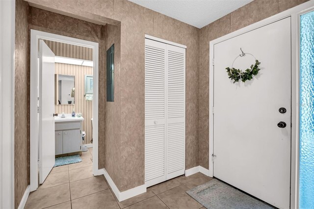 2506 Laurelwood Dr Unit 4C, Clearwater, FL 33763 - entryway with light tile patterned flooring and baseboards