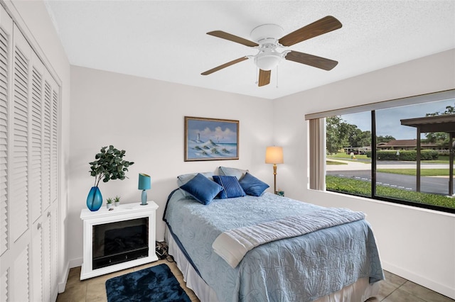 2506 Laurelwood Dr Unit 4C, Clearwater, FL 33763 - tiled bedroom with baseboards, ceiling fan, and a closet