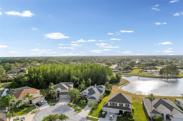 birds eye view of property featuring a residential view and a water view