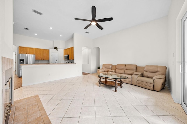 living room with visible vents, ceiling fan, light tile patterned flooring, and recessed lighting