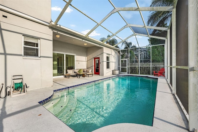view of swimming pool with a patio, an outdoor living space, a fenced in pool, and glass enclosure