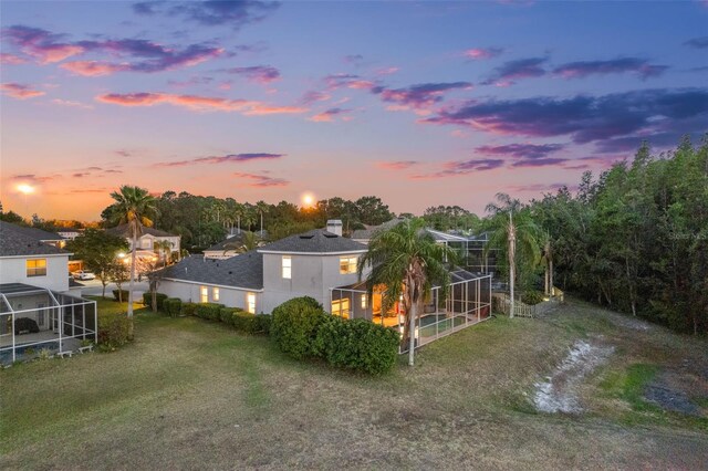 rear view of property with glass enclosure
