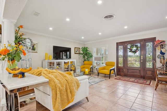 living room with crown molding, recessed lighting, visible vents, and decorative columns