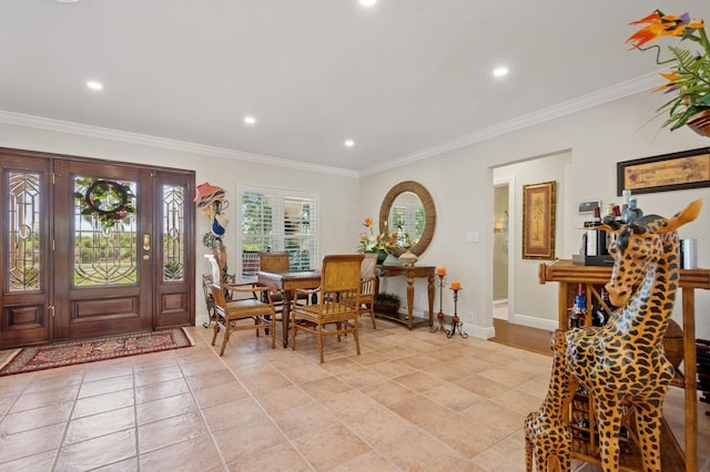 foyer featuring recessed lighting and crown molding