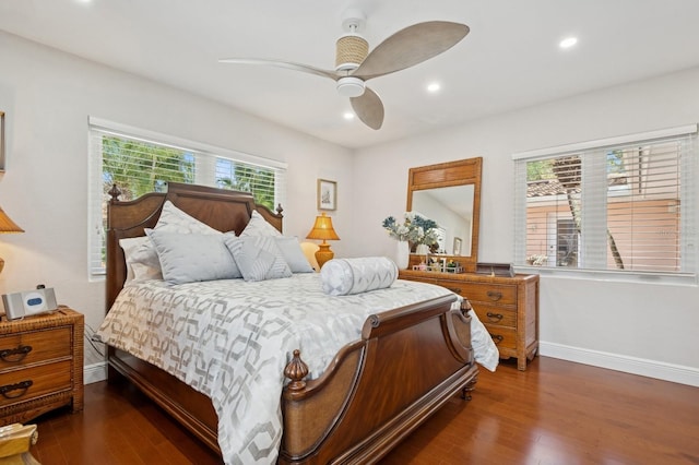 bedroom featuring wood finished floors, recessed lighting, and baseboards