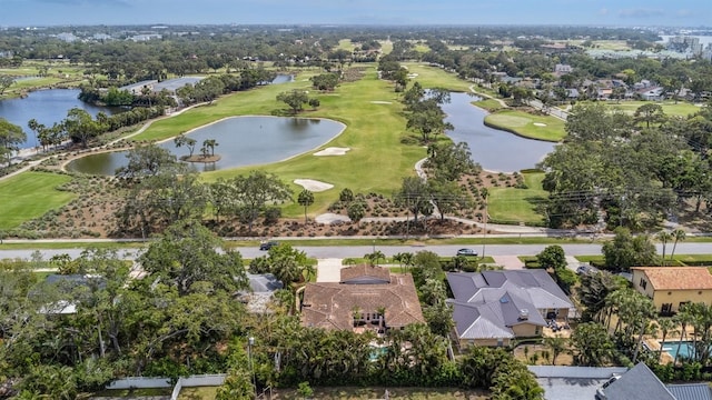 bird's eye view with a residential view, a water view, and view of golf course