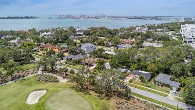 birds eye view of property with view of golf course, a water view, and a view of city
