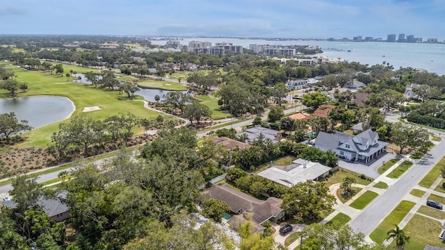 birds eye view of property with a view of city, a residential view, a water view, and view of golf course