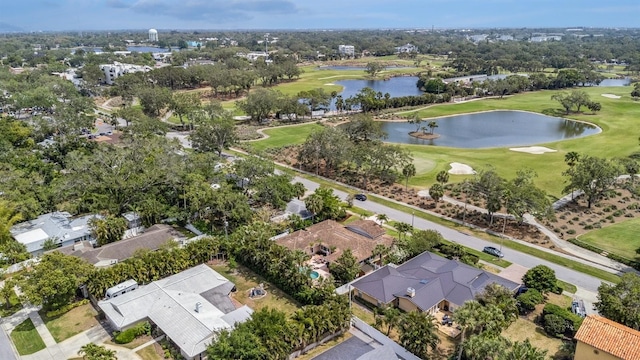 birds eye view of property featuring a residential view, a water view, and view of golf course