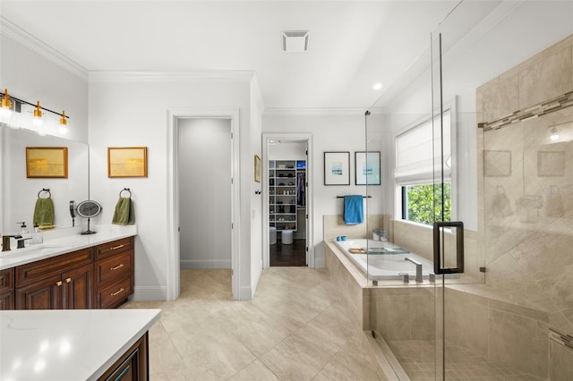 bathroom featuring vanity, visible vents, ornamental molding, a bath, and a stall shower