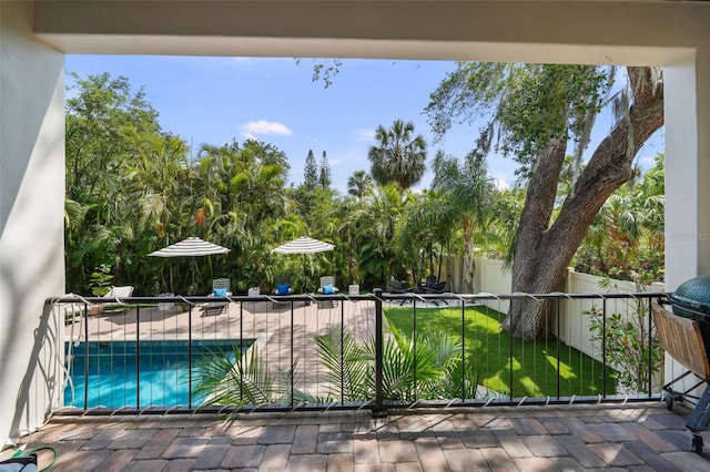 view of pool featuring fence