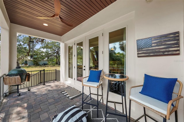 view of patio / terrace with french doors and a ceiling fan