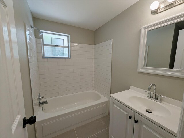 bathroom with tile patterned flooring, shower / bathing tub combination, and vanity