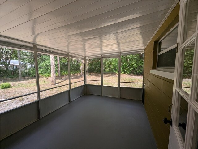 unfurnished sunroom featuring a healthy amount of sunlight