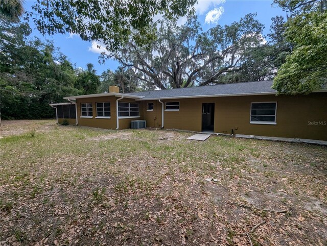 back of property featuring cooling unit