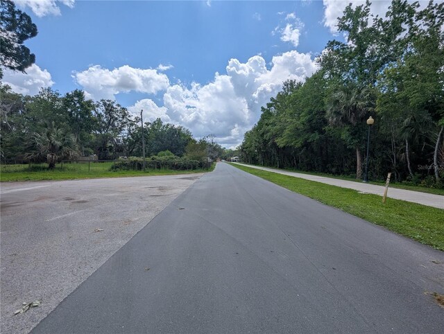 view of road featuring street lights