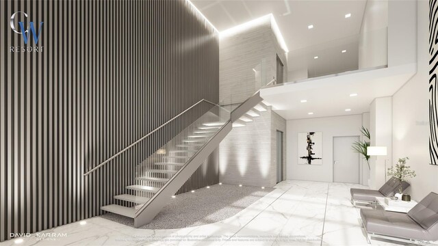 411 E Shore Dr Unit 202, Clearwater Beach, FL 33767 - stairway featuring a towering ceiling and marble finish floor