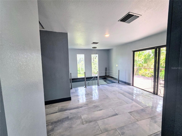 3911 6th Ave W, Palmetto, FL 34221 - empty room with a textured ceiling and a textured wall