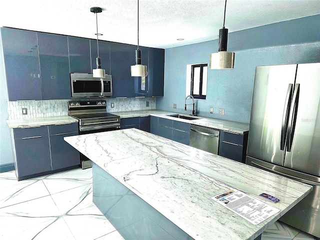 3911 6th Ave W, Palmetto, FL 34221 - kitchen featuring stainless steel appliances, decorative backsplash, decorative light fixtures, light stone counters, and a kitchen island