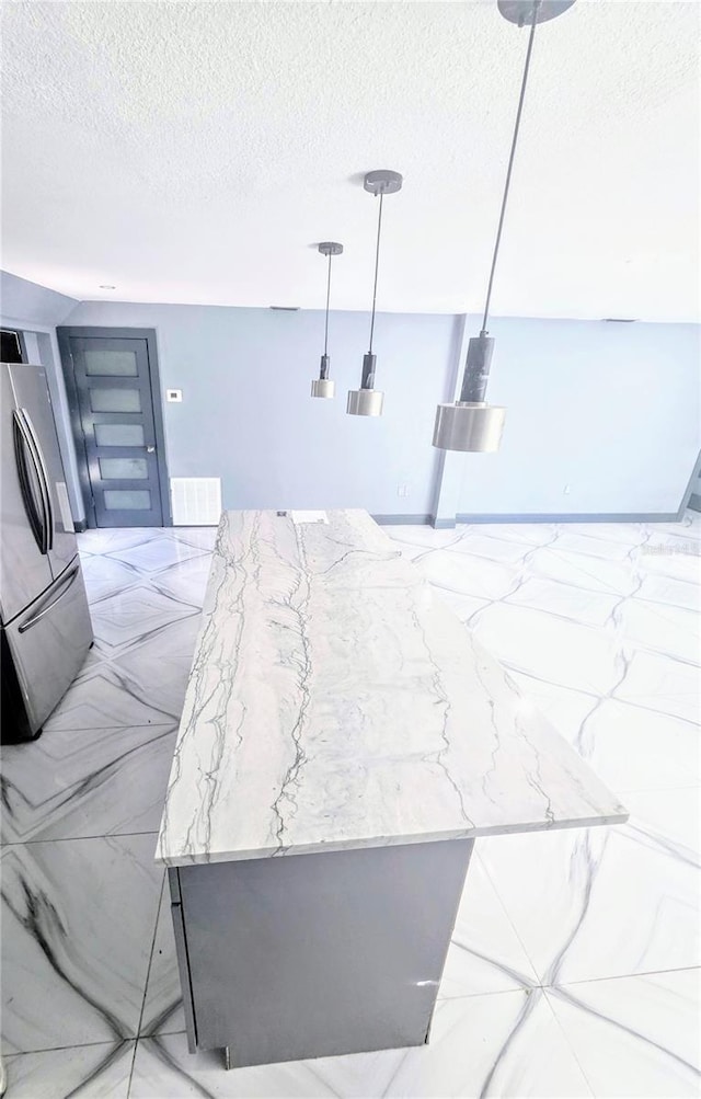 3911 6th Ave W, Palmetto, FL 34221 - bedroom featuring freestanding refrigerator and a textured ceiling