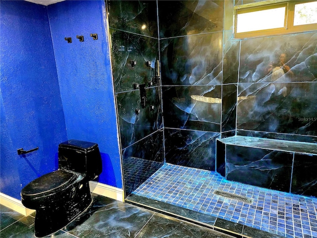 3911 6th Ave W, Palmetto, FL 34221 - full bath with tiled shower, a textured wall, and marble finish flooring