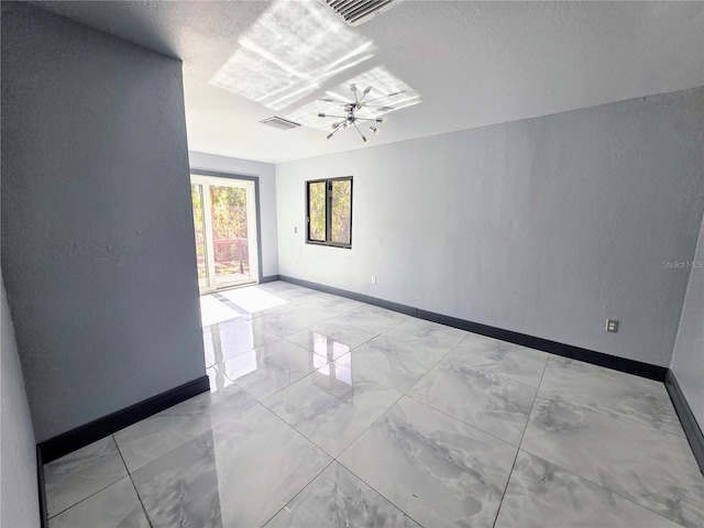 3911 6th Ave W, Palmetto, FL 34221 - empty room with light marble finish floors and a textured wall