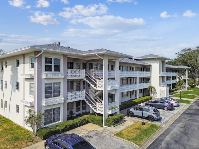 1235 S Highland Ave Unit 2-207, Clearwater, FL 33756 - view of apartment building / complex featuring uncovered parking