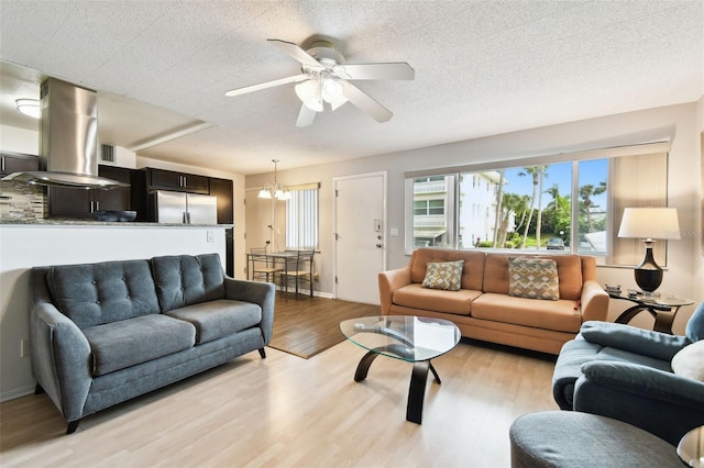 1235 S Highland Ave Unit 2-207, Clearwater, FL 33756 - living room featuring light wood-style floors, ceiling fan, and a chandelier