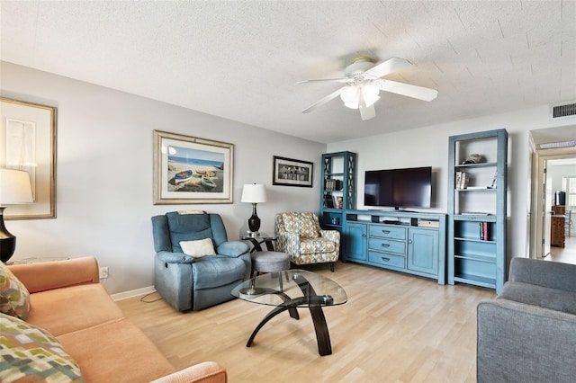 1235 S Highland Ave Unit 2-207, Clearwater, FL 33756 - living room with light wood finished floors, a ceiling fan, and baseboards