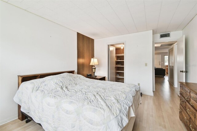 1235 S Highland Ave Unit 2-207, Clearwater, FL 33756 - bedroom featuring light wood-style floors and baseboards