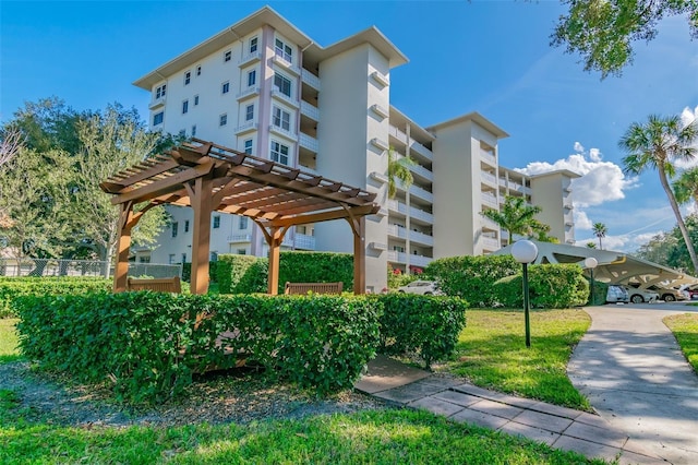 1235 S Highland Ave Unit 2-207, Clearwater, FL 33756 - surrounding community featuring a pergola and fence