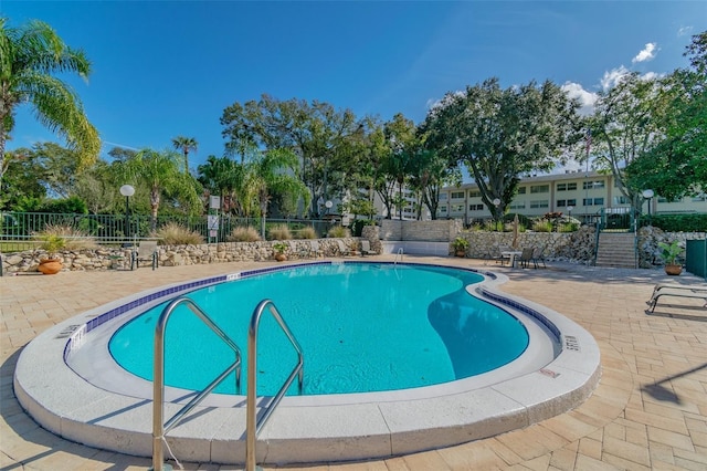 1235 S Highland Ave Unit 2-207, Clearwater, FL 33756 - community pool featuring a patio area and fence