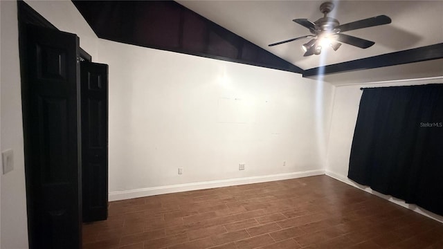 7017 Baywood Dr, Tampa, FL 33637 - spare room featuring baseboards, dark wood finished floors, ceiling fan, and vaulted ceiling