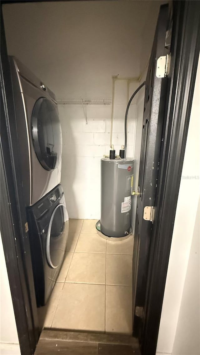 7017 Baywood Dr, Tampa, FL 33637 - washroom with stacked washer and clothes dryer, water heater, and laundry area