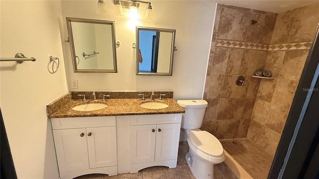 7017 Baywood Dr, Tampa, FL 33637 - full bath featuring a sink, double vanity, toilet, and a tile shower